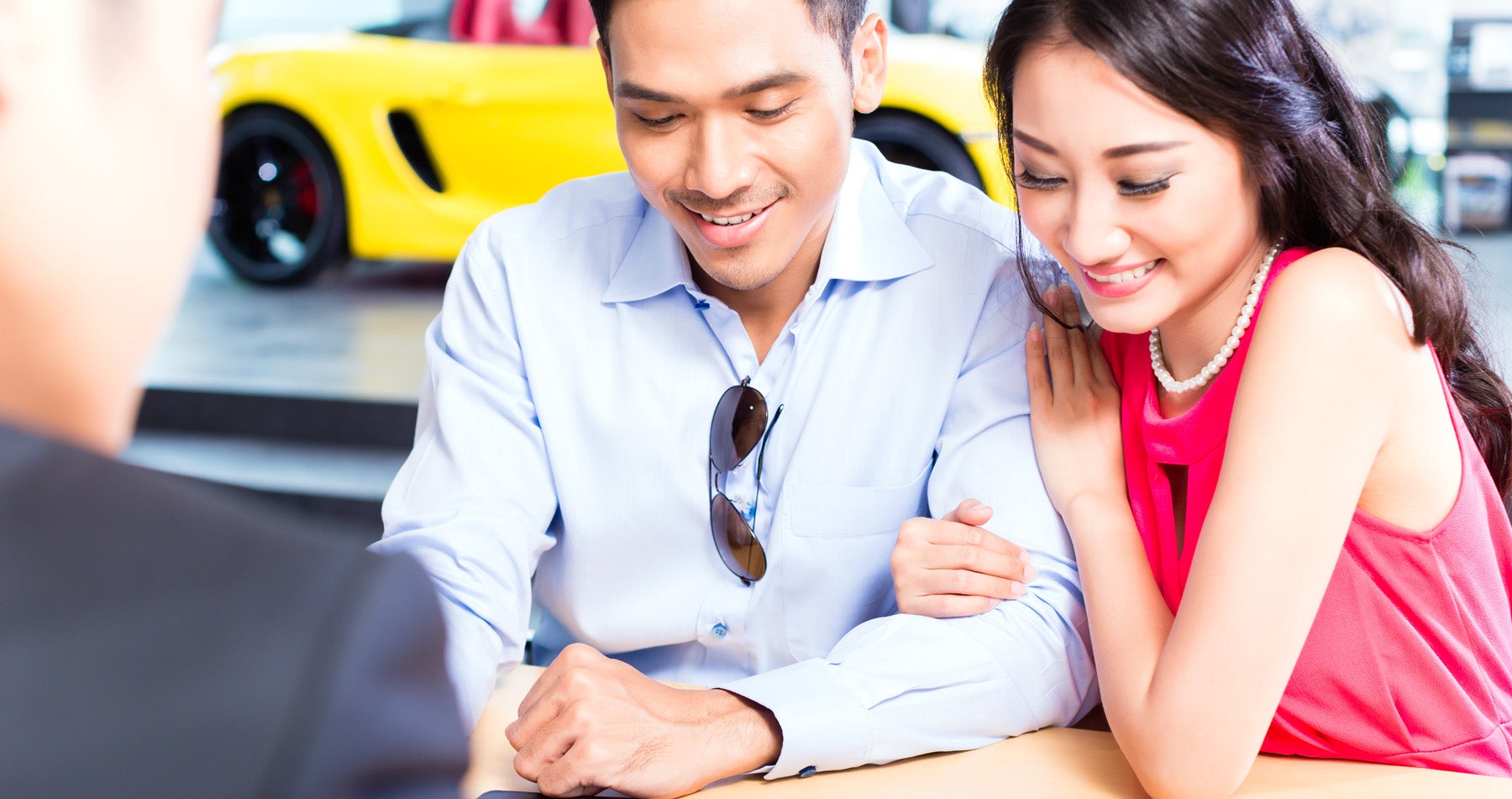 Couple looking at car financing options